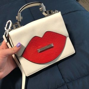 Kendall and Kylie leather lips purse